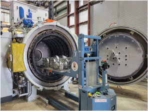 Loading a single-chamber high pressure gas quench vacuum furnace with dies at Youngstown Tool & Die.